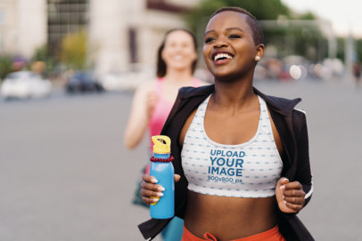 Sports Bra Mockup of a Joyful Woman Running in the Street