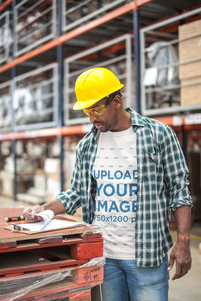 Industrial Worker Going Through a Checklist Wearing a T-Shirt Mockup