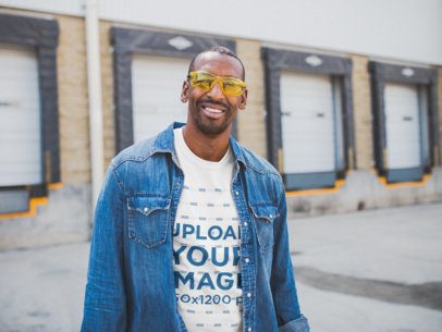 Smiling Worker Wearing a T-Shirt Mockup Outside the Factory