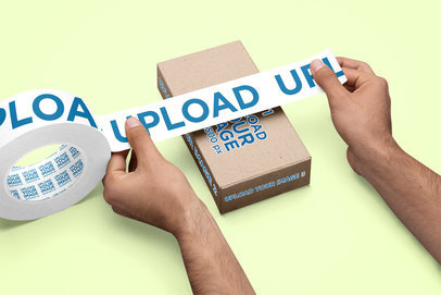 Mockup of a Man Putting a Branding Tape on a Box