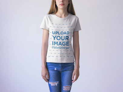 Closeup of a Teen Wearing a Generic T-Shirt Mockup Against a White Background