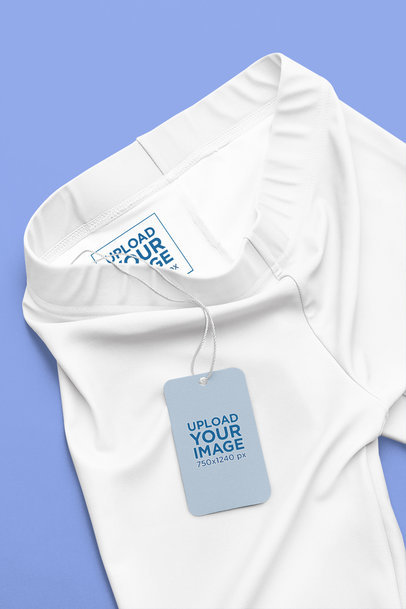 Mockup of Brand Tag Hanging on a Pair of Leggings Featuring an Inside Label