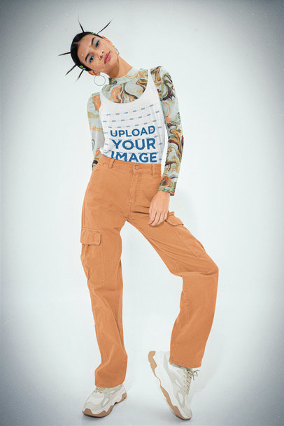 Y2K-Inspired Mockup of a Woman Wearing a Bella Canvas Tank Top at a Studio