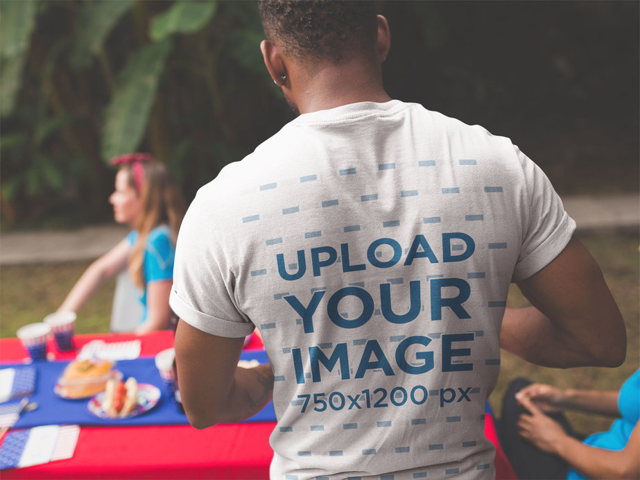 Back of a Man Wearing a T-Shirt Mockup at a 4th of July BBQ Party