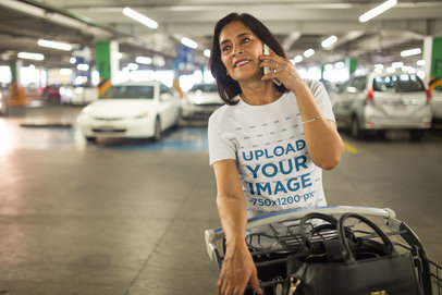 Woman Making a Phone Call Wearing a T-Shirt Mockup at a Parking Lot a20351