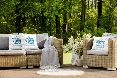 Mockup of Three Squared Pillows Placed on Patio Furniture 