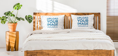 Mockup of Two Sublimated Pillows Placed on a Bed with a Wooden Base m30992 r-el2
