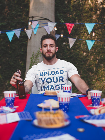 T-Shirt Mockup Being Worn by a Man at a 4th of July BBQ Party
