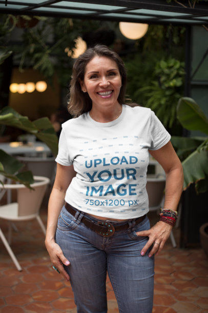 Senior Woman Posing Wearing a T-Shirt Mockup at a Coffee Shop a20364