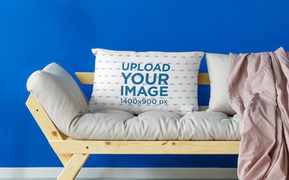 Mockup of a Pillow Placed on a Loveseat 