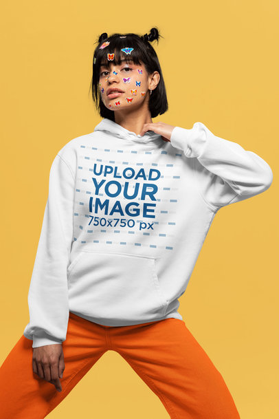 Hoodie Mockup Featuring a Woman With Butterfly Stickers on Her Face
