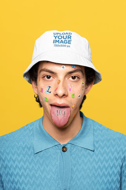 Bucket Hat Mockup Featuring a Man Showing a LOL Sticker on His Tongue