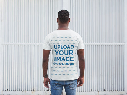 Back Shot Tshirt Mockup of a Man Facing a White Metal Door
