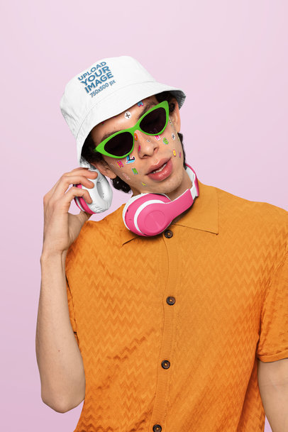 Bucket Hat Mockup of a Man with Face Stickers and Headphones