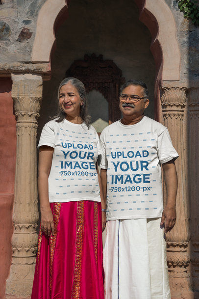 Gildan T-Shirt Mockup Featuring a Senior Couple Posing in Traditional Indian Attires