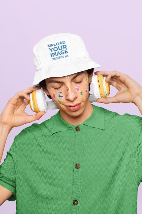 Mockup of a Man with Face Stickers Wearing a Bucket Hat