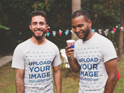 Interracial Pair of Friends Wearing T-Shirts Mockup at a 4th of July BBQ Party