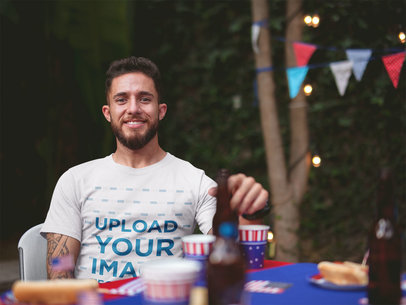 Happy Man Wearing a Tshirt Mockup at a 4th of July BBQ Party