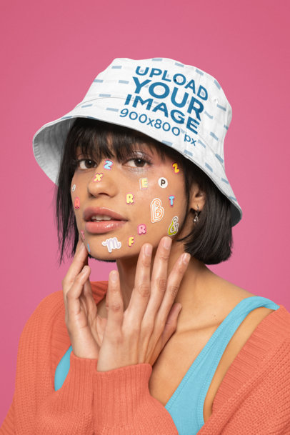 Bucket Hat Mockup of a Woman with Colorful Letter Stickers on Her Face