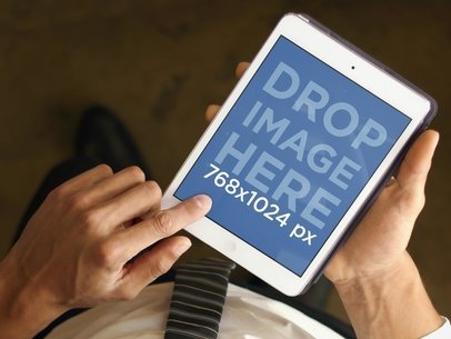 Businessman With iPad Mini From Above