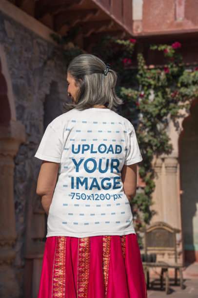 Back-View Gildan T-Shirt Mockup Featuring a Senior Woman With a Traditional Skirt