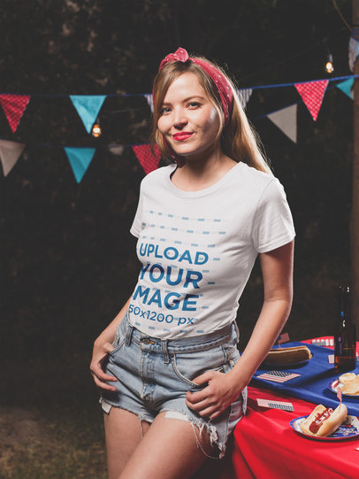 Smiling Woman Wearing a Tshirt Mockup at a 4th of July BBQ Party