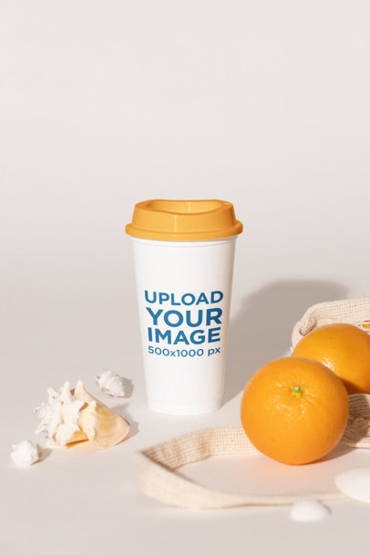 Mockup of a Paper Coffee Cup Placed in an Aesthetic Setting