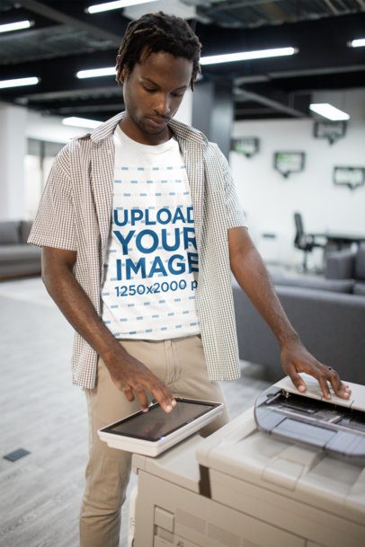 Portrait of a Man with Short locks Wearing a Tshirt Mockup Using a Printer a20514