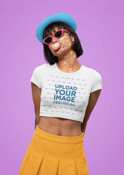 Bella Canvas Crop Top Mockup of a Woman with Face Stickers Blowing a Gum Bubble