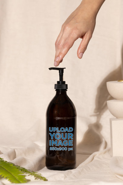Mockup of an Amber Pump Bottle in an Aesthetic Setting