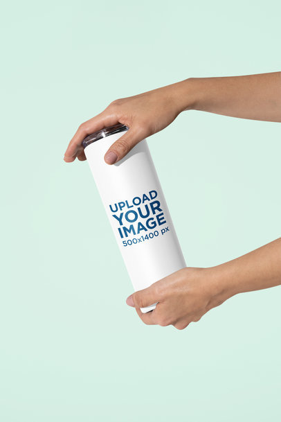 Mockup of a Woman Holding a Skinny Tumbler with Both Hands