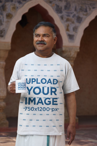 Gildan T-Shirt Mockup Featuring an Elderly Man Holding an 11 oz Mug