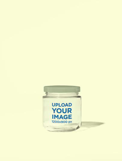 Mockup of an Eco Glass Jar Placed on a Colorful Background