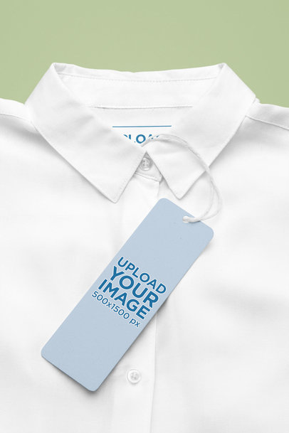 Mockup of a Brand Tag Hanging From a Button-Up Shirt m31977