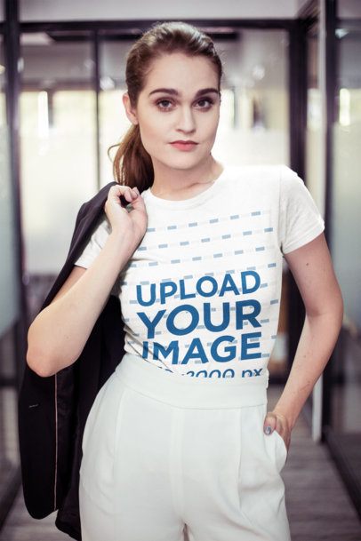 Portrait of a Woman Wearing a Tshirt Mockup Holding a Jacket Against her Back