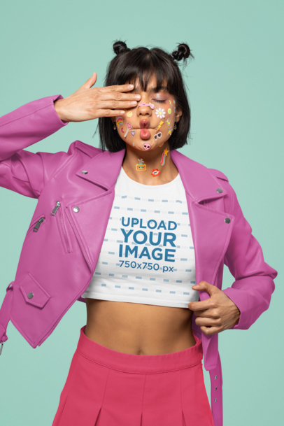 Mockup of a Woman with Colorful Face Stickers Wearing a Bella Canvas Crop Top