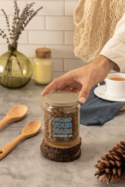 Mockup of a Man Grabbing a Glass Jar