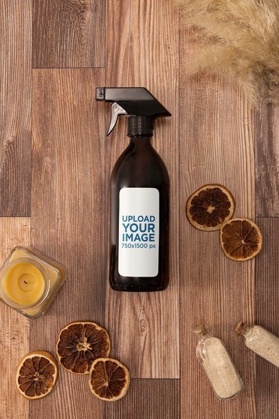 Mockup of a Glass Spray Bottle Lying on a Wooden Aesthetic Surface