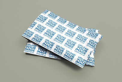 Mockup of Two Poly Mailers Placed on a Customizable Surface