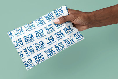 Mockup of a Person Holding a Poly Mailer m32444