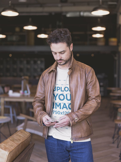 Man Wearing a Tshirt Mockup Sending a Text Message