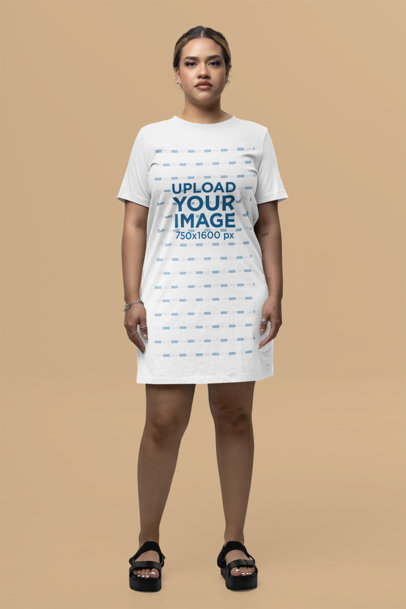 T-Shirt Dress Mockup Featuring a Serious Woman Posing in a Studio
