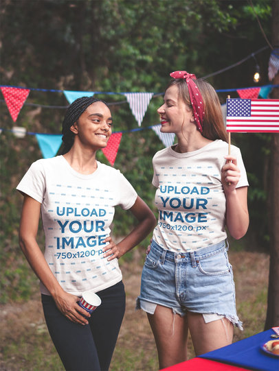 Interracial Pair of Friends Wearing Tshirts Mockup at a 4th of July BBQ Party a20836