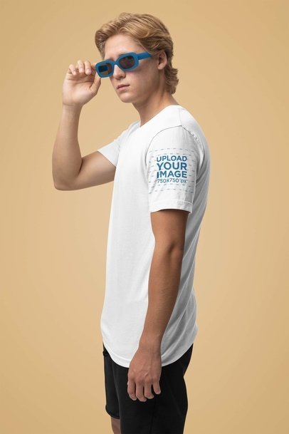 Mockup of a Man Wearing Sunglasses and a T-Shirt with a Customizable Sleeve
