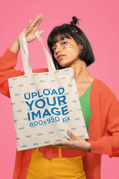 Mockup of a Woman with Face Stickers Holding a Sublimated Tote Bag