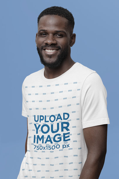 Rounded-Neck Bella Canvas Tee Mockup of a Smiling Man at a Studio