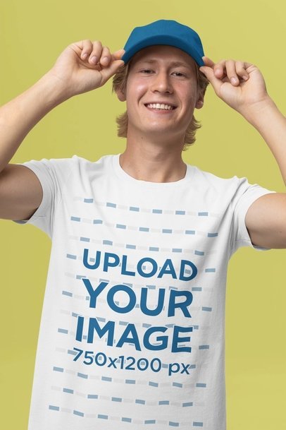 Round-Neck Tee Mockup Featuring a Happy Man Posing in a Studio