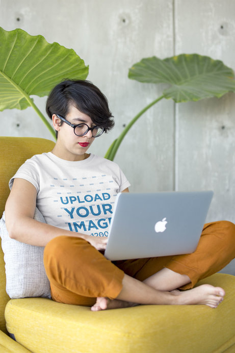 Woman Working on her Laptop Wearing a Tshirt Mockup