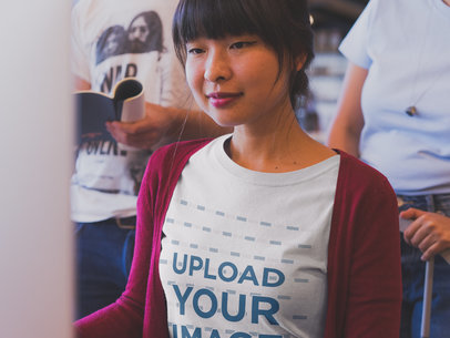 Asian Woman Wearing a T-Shirt Mockup while Working at a Startup