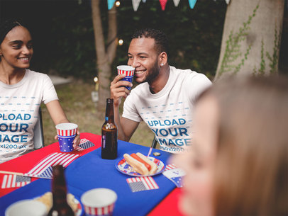 Happy Couple Wearing TShirts Mockup at a 4th of July BBQ Party